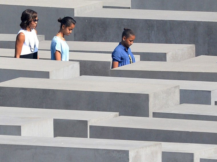 First lady Michelle Obama and her daughters Sasha (right) and Malia visit the Memorial to the Murdered Jews of Europe in Berlin, Germany, on June 19, 2013.