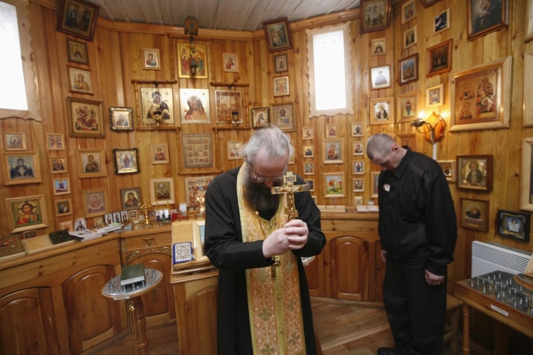 An Orthodox priest leads the Easter service during the week after Orthodox Easter at the high-security prison camp outside Krasnoyarsk, Siberia.