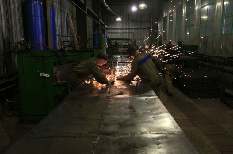 Inmates work in a metal processing shop inside the prison camp outside Russia's Siberian city of Krasnoyarsk on May 14.