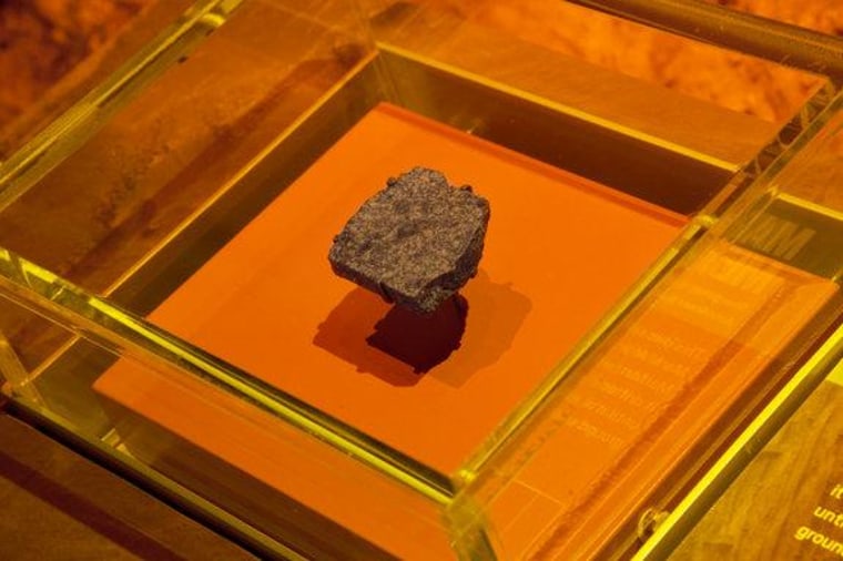 This piece of hardened lava came from Mars. After being knocked off the Martian surface by an asteroid or comet, it drifted in space for millions of years, until it reached Earth and fell to the ground as a meteorite.