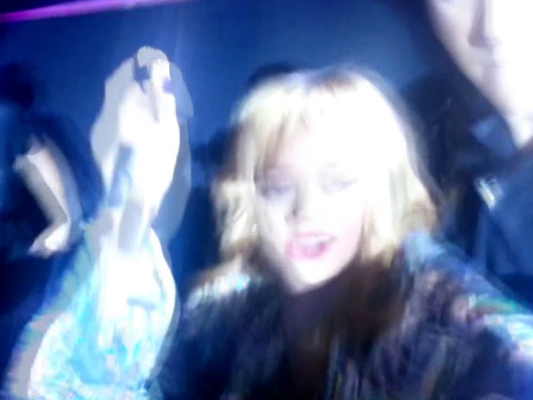 A screengrab from a YouTube video of Rihanna in concert.