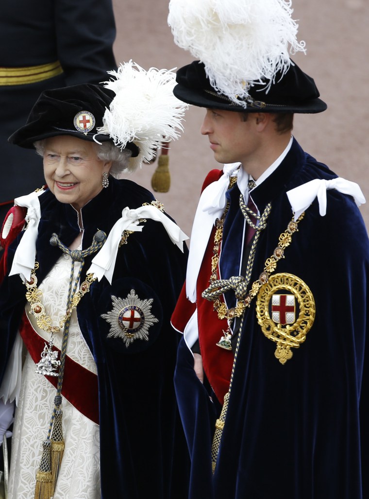 Britain's Queen Elizabeth II walks in procession with Prince William, right, in the annual Garter Ceremony at Windsor Castle, England, Monday, June 17...