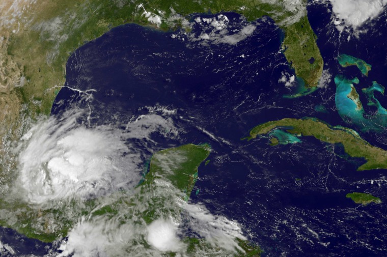 A satellite image from NASA showing Tropical Storm Barry hitting eastern Mexico.