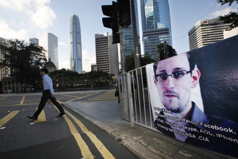 A banner supporting Edward Snowden, a former CIA employee who leaked top-secret documents about sweeping U.S. surveillance programs, is displayed at Central, Hong Kong's business district on June 18.