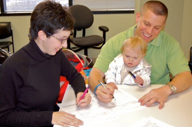 Signing Grayson's adoption papers in late 2010.