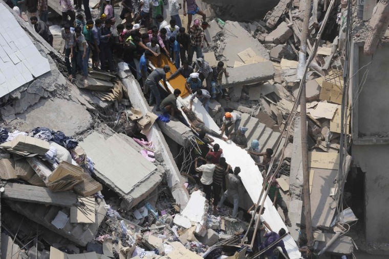 People rescue garment workers trapped under rubble at the Rana Plaza building after it collapsed, in Savar, 19 miles outside Dhaka April 24, 2013. An eight-story block housing garment factories and a shopping center collapsed on the outskirts of the Bangladeshi capital on Wednesday, killing more than 1,100 people and injuring more than 2,000.