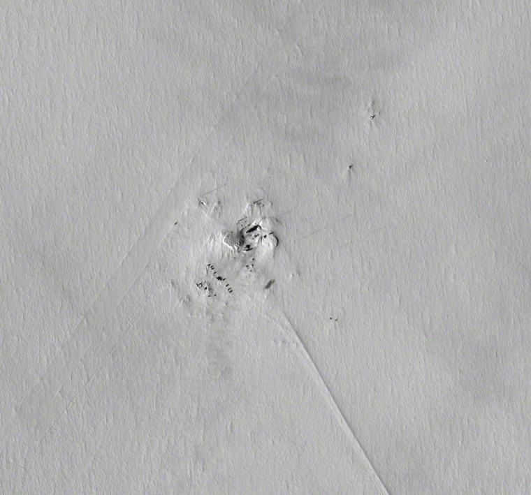 This wider version of the WorldView 1 picture of Vostok Station shows more of the Antarctic wasteland surrounding the facility. Compared with the close-up, this view is rotated roughly 65 degrees clockwise. The skiway on which supply planes land can be seen running diagonally from top center to lower left, while the ice road to Russia's Mirny Station on the coast runs from the settlement toward lower right.