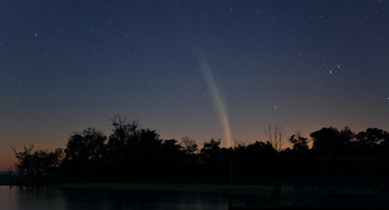 Australian photographer Colin Legg captured this photograph of Comet Lovejoy's tail flaring up from the horizon just before sunrise Wednesday.