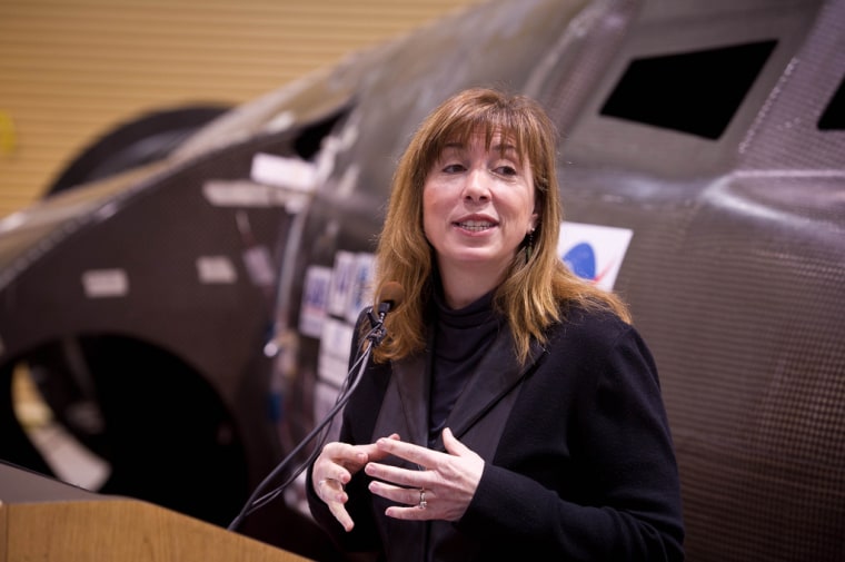 NASA Deputy Administrator Lori Garver, seen here during a February news conference with Sierra Nevada Corp.'s Dream Chaser spaceship, says providing funds for U.S. spaceship developers now will reduce payments to the Russians later.