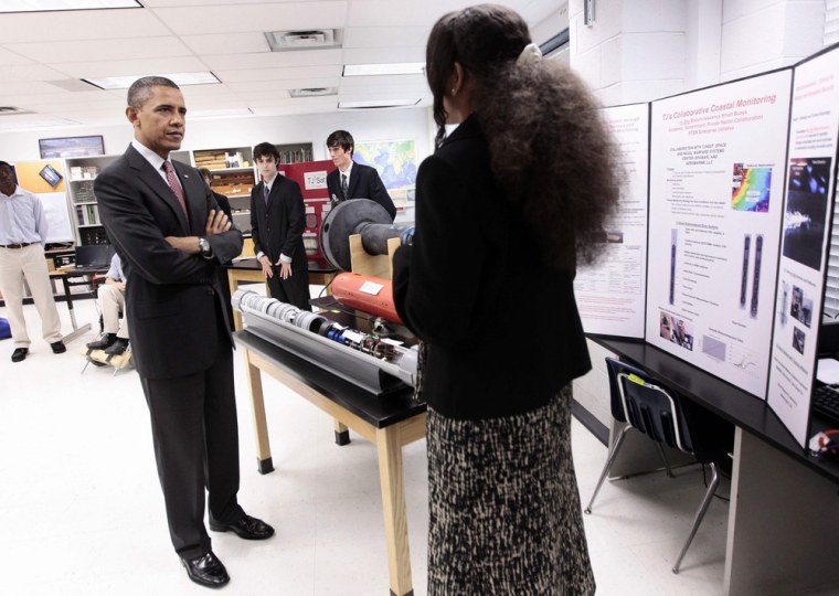 President Barack Obama listens to student Alexandria Sutton, 16, during his visit to a classroom at Thomas Jefferson High School for Science and Technology in Alexandria, Va., in September.