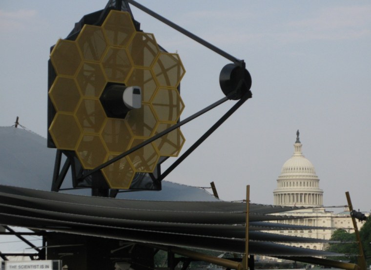 The U.S. Capitol looms in the background as a full-scale mockup of the James Webb Space Telescope goes on display in Washington in 2007.