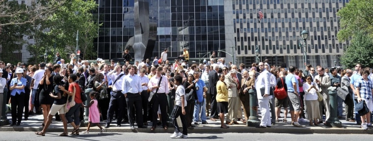 People stand in a square outside the courthouse after an earthquake was felt in New York Tuesday, causing buildings to be evacuated. The Pentagon, the U.S. Capitol and Union Station in the nation's capital were all evacuated after the 5.9-magnitude quake, which was shallow with its epicenter only 0.6 miles (one kilometer) underground.