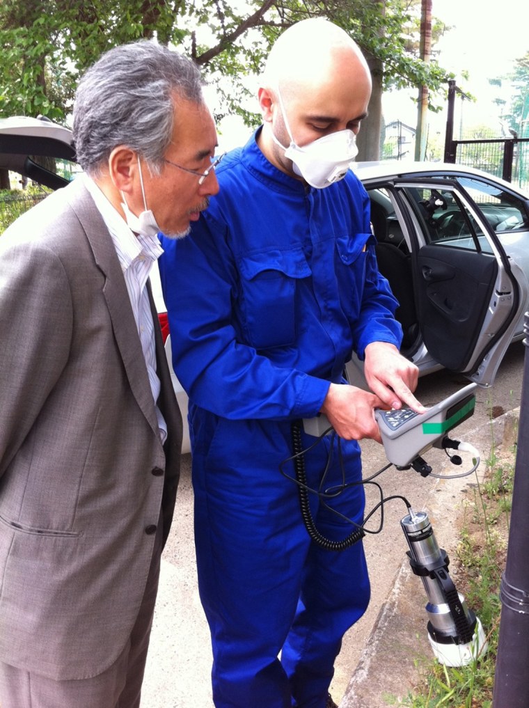 Volunteer Toshikatsu Watanabe, left, and Safecast's Kalin Kozhuharov take radiation measurements in Koriyama, Japan.