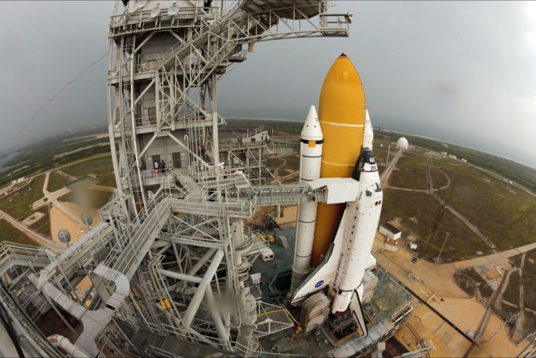 The morning after rollout, NASA's space shuttle Atlantis rests on the launch pad at Kennedy Space Center in Florida.