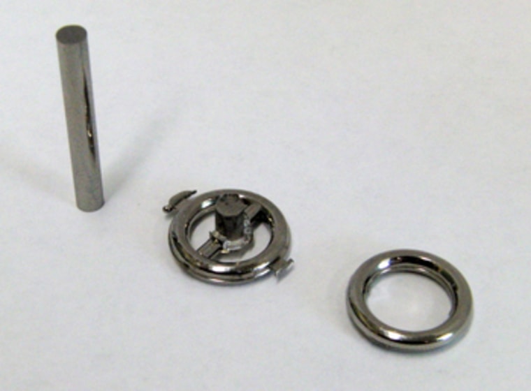 A metallic-glass rod before heating and molding (left); a molded metallic-glass part (middle); the final product with its excess material trimmed off (right).