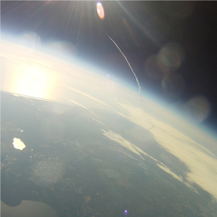 The shuttle Endeavour leaves behind an arcing plume of exhaust in this picture, captured on Monday by the Senatobia-1 balloon from an altitude of 64,000 feet.