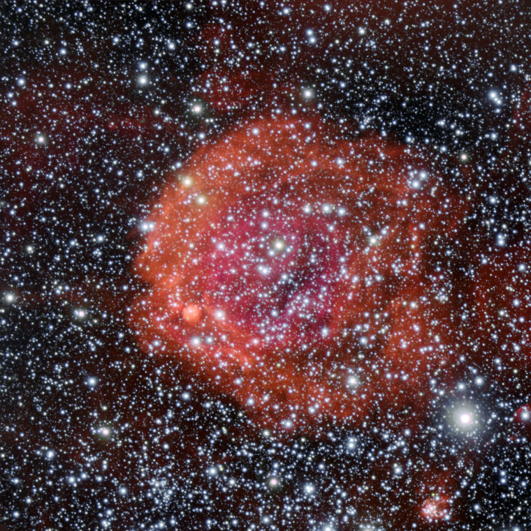 NGC 371 glows in a picture taken using the FORS1 instrument on the European Southern Observatory's Very Large Telescope in Chile. NGC 371 lies in the Small Magellanic Cloud.