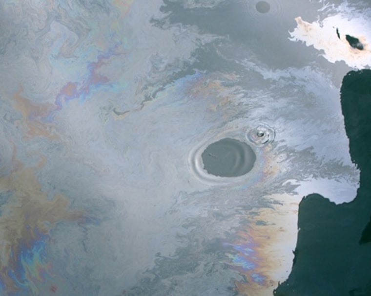 A fresh oil slick from the Deepwater Horizon spill, during June 2010. Note that one drop of detergent was added to the oil slick, forming the cleared circle. A chemical of such dispersants lingers in the deep ocean, a new study found.