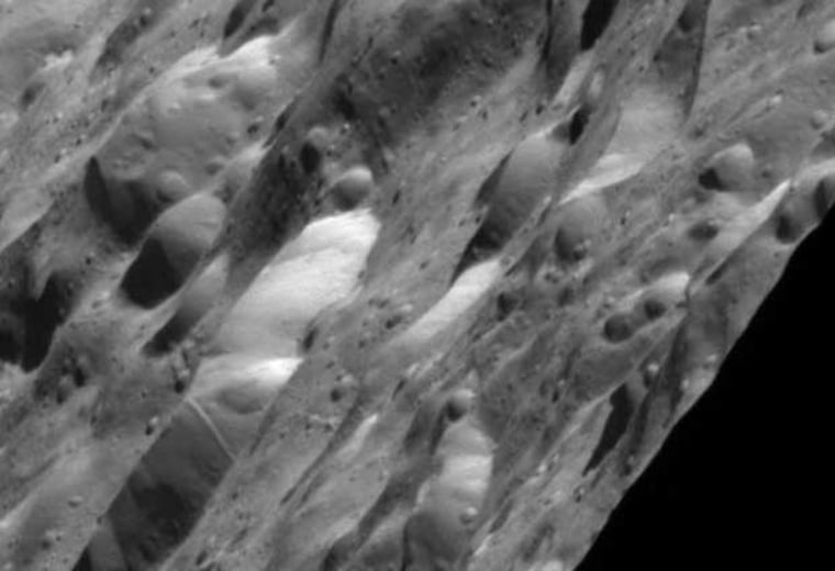 The Cassini orbiter's wide-angle camera took this image of Rhea as it flew past at a distance of about 120 miles (200 kilometers) from the Saturnian moon's surface.