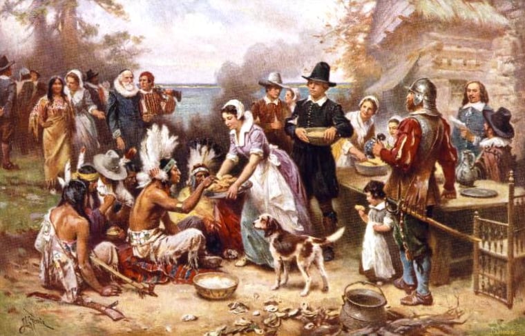 This traditional depiction of the first Thanksgiving in 1621, created by Jean Leon Gerome Ferris in 1932, shows Pilgrims and Native Americans sitting down together for a meal.