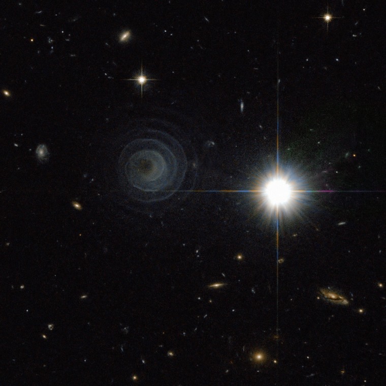 The Hubble Space Telescope spots an unusual spiral nebula around the star LL Pegasi. Astronomers say the spiral shape was created by material swirling out from one of the stars in a binary-star system. See larger versions of the image.