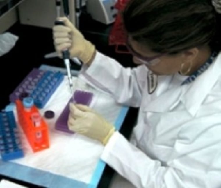 A criminalist conducts DNA testing at a California lab.