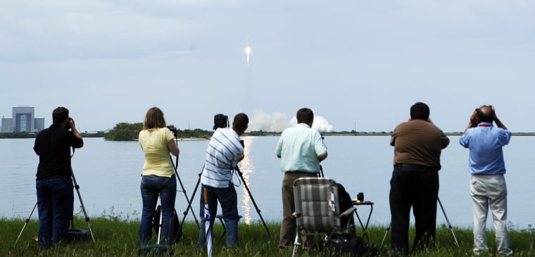 Photographers focus on today's ascent of SpaceX's Falcon 9 rocket from Cape Canaveral Air Force Station in Florida.