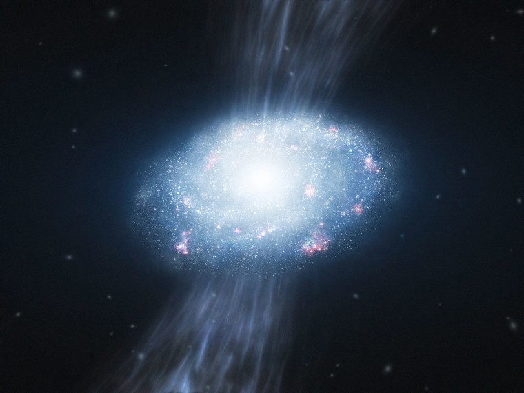 An artist's impression shows the young galaxy UDFy-38135539 gathering up the hydrogen and helium gas surrounding it and forming many young stars. Astronomers have determined that UDFy-38135539 is the most distant known galaxy.