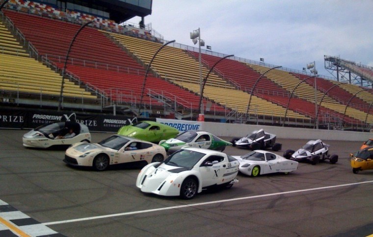 Automotive X Prize contenders take a spin on the track at the Michigan International Speedway on Monday.