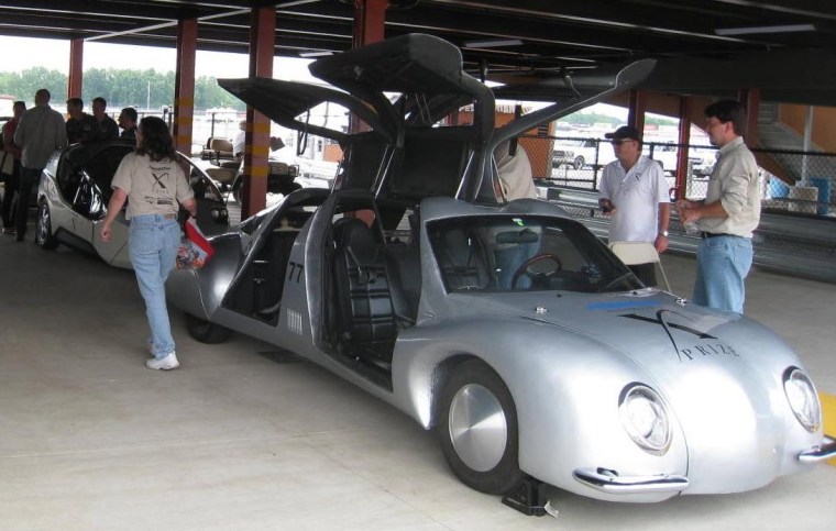 Illuminati Motor Works' Seven has its gull-wing doors open while parked at the Michigan International Speedway.