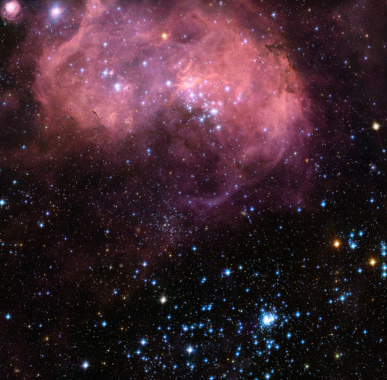 This broad vista of young stars and gas clouds in our neighboring galaxy, the Large Magellanic Cloud, was captured by the Hubble Space Telescope's Advanced Camera for Surveys. The star-forming region is known as N11 or the Bean Nebula.