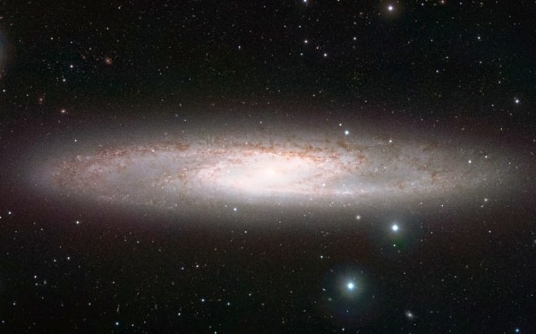 The Sculptor Galaxy, NGC 253, whirls in all its glory in an infrared image from ESO's VISTA telescope in Chile.