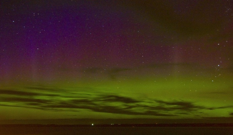 Clouds hanging over South Dakota cleared at around 11:30 p.m. CT Tuesday to reveal an aurora, photographed by Jenna Nagel. Auroral displays were visible in northern Europe, Canada and the northern U.S. Click through our aurora slideshow.