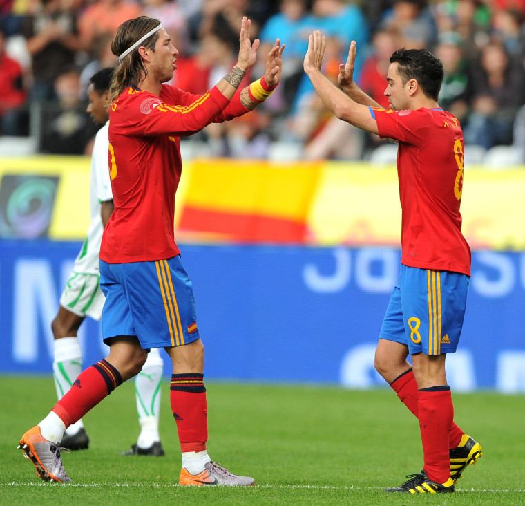 Spain's Sergio Ramos and Xavi Hernandez, seen during a match in May, ranked highest in a study that used network analysis to rate soccer players.