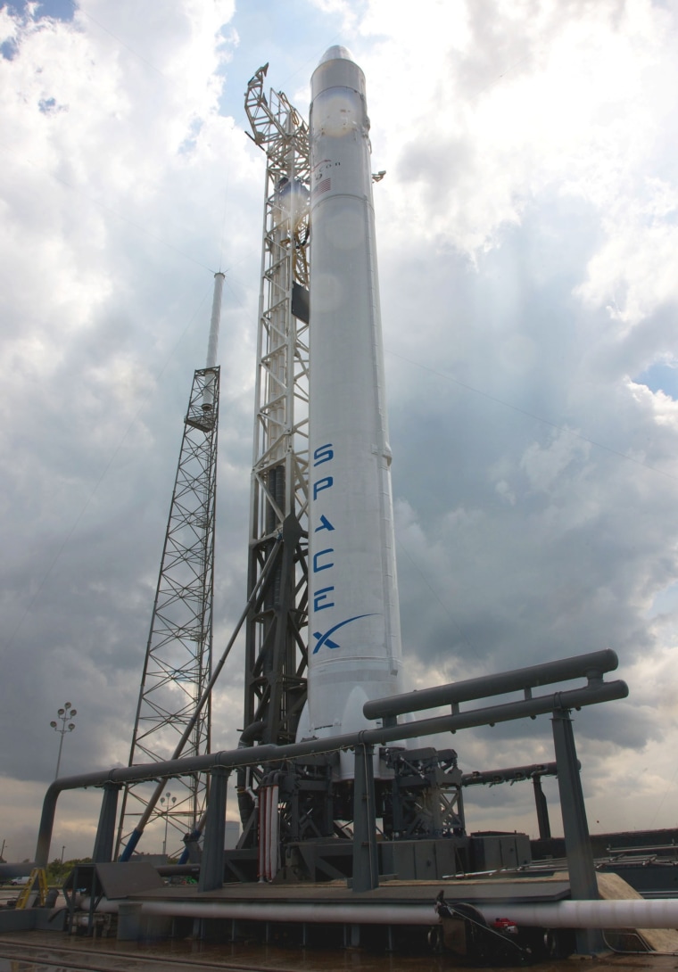 SpaceX's Falcon 9 rocket stands on its launch pad at Cape Canaveral Air Force Station, ready for its scheduled maiden flight on Friday.