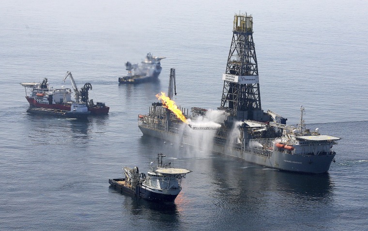 Flames from burning methane are vented off the side of the Discoverer Enterprise drillship in the Gulf of Mexico as it processes oil and gas brought up from a leaking well. The processing operation is due to expand quickly over the next two weeks.