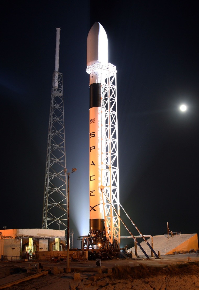 The SpaceX Falcon 9 rocket sits on its launch pad at Cape Canaveral Air Force Station.
