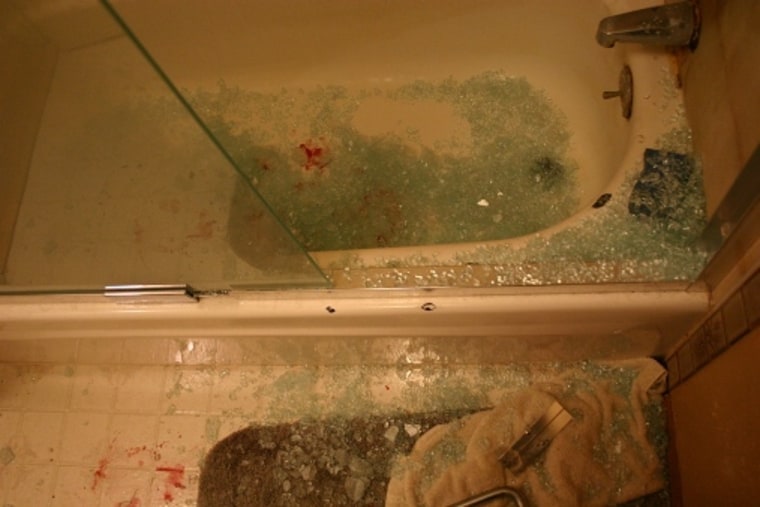 This was the grisly scene in my bathroom after a shower door exploded on me while I showered. I bled substantially from a wound on my right foot and had to walk on glass to get out.