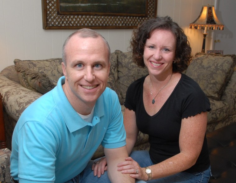 In this Thursday, May 11, 2006 file photo, Alan Chambers, left, president of Exodus International, sits with his wife, Leslie, in their home in Winter Park, Fla.