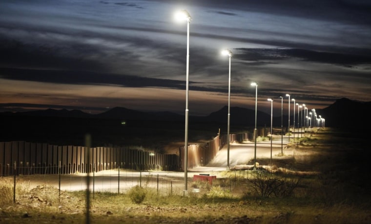 The feds have already build 670 miles of fence on the border, like this one near Naco, Ariz. A deal in the Senate calls for the completion of 700 more miles.