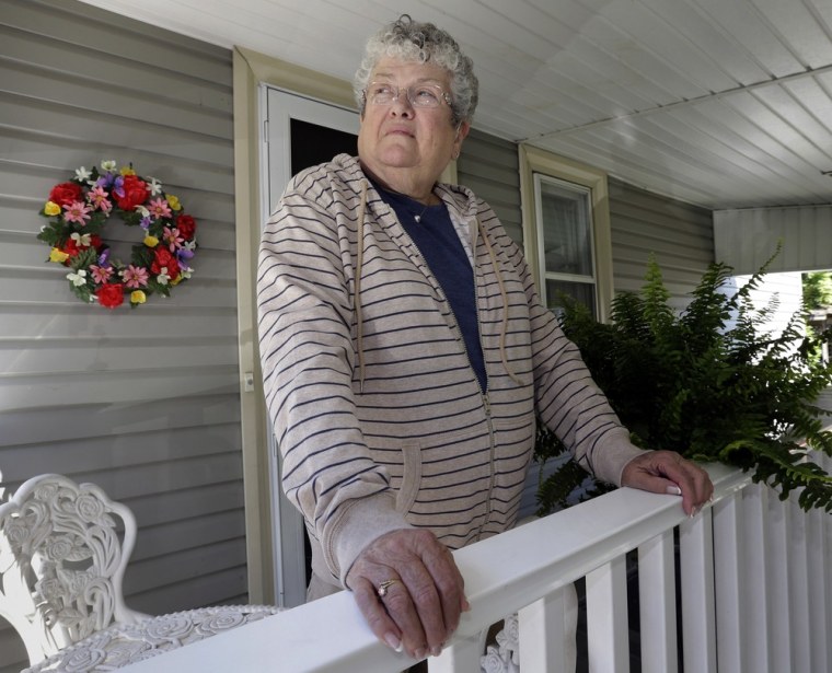Former school bus monitor Karen Klein stands on the porch at her home in Greece, N.Y.