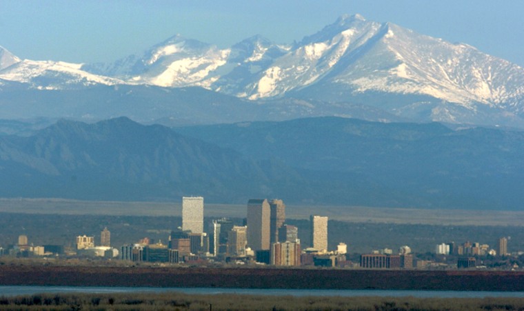 At top, on a clear morning, the downtown Denver skyline with the front range peaks of the Rocky Mountains in the background and Cherry Creek Reservoir...