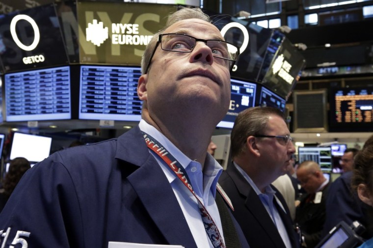 What goes up... Trader David O'Day, left, works on the floor of the New York Stock Exchange, Friday, June 21, 2013.