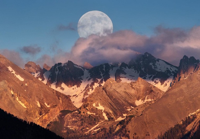 Photographer Mike Long captured this view of the nearly full moon rising over the French Alps on Saturday.