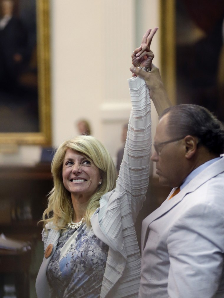 Sen. Wendy Davis, D-Fort Worth, left, reacts as time expires following her lengthy filibuster.