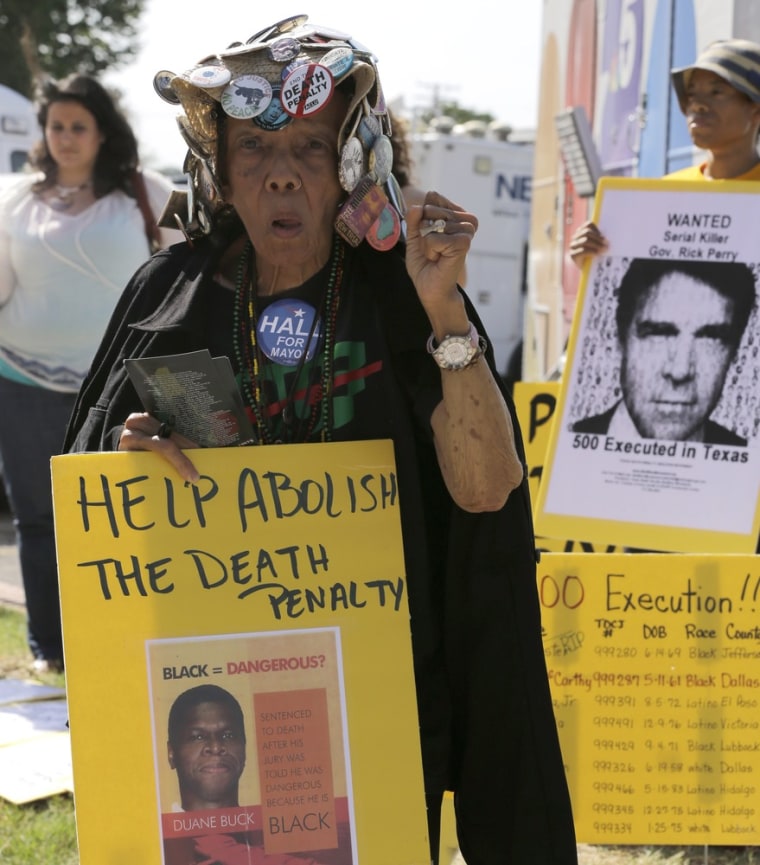 Jean Wilkins Dember, 83, joins others Wednesday, June 26, as they protest the 500th execution in Texas outside the Texas Department of Criminal Justice Huntsville Unit. Kimberly McCarthy was set to be executed Wednesday evening.