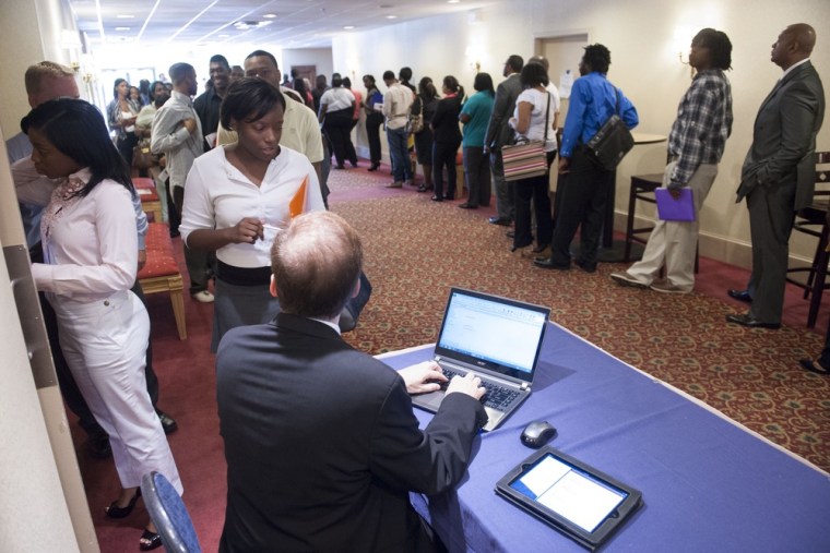 Job seekers line up to register to attend a job fair held in Atlanta, Thursday, May 30, 2013. The Labor Department reports on the number of Americans ...