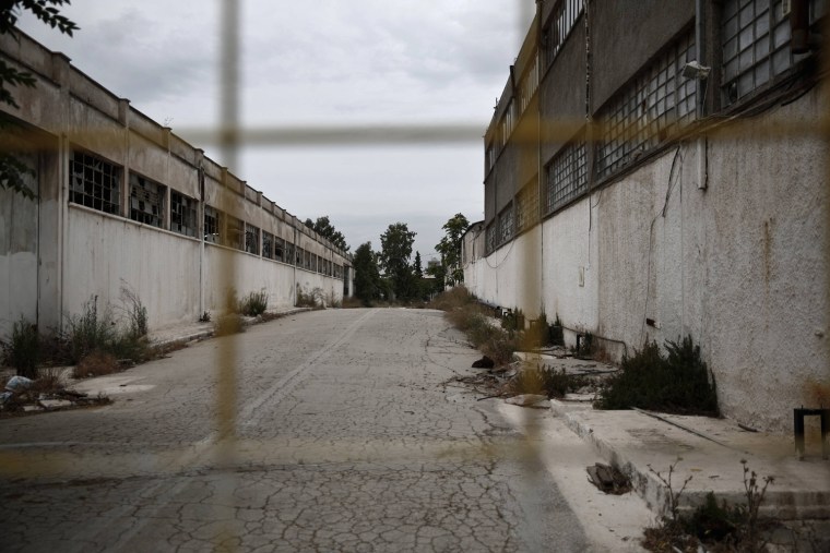 A view of an old naval base, an area where a mosque is going to be built at Votanikos suburb in Athens May 28, 2013. Greece's plan to build a state-funded mosque in the capital, more than a century in the making, comes as a relief, even if it will be housed in a disused naval base littered with weeds and rubble in a rundown neighbourhood. The mosque's critics say Athens, kept afloat by an international bailout, cannot spare the almost one million euros it will cost given that Greece is in a sixth year of recession, with record high unemployment and sinking living standards. Picture taken May 28, 2013. REUTERS/Yorgos Karahalis (GREECE - Tags: POLITICS BUSINESS SOCIETY IMMIGRATION RELIGION)