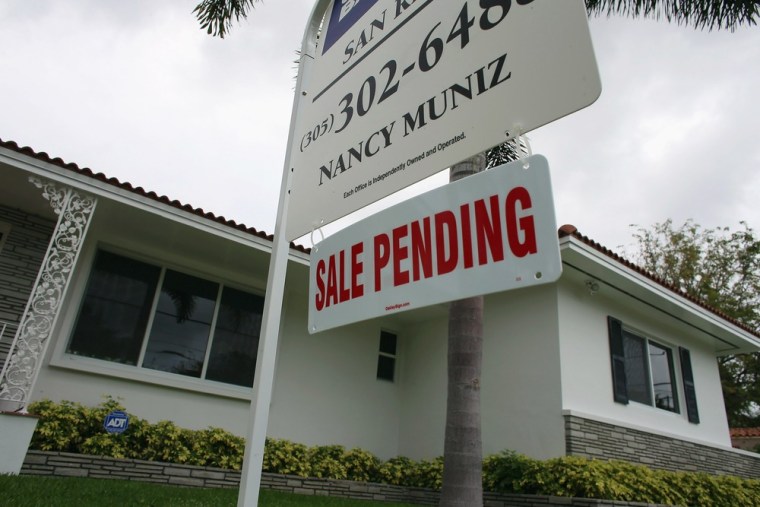A Sale Pending sign is seen in front of a home on April 29, 2013 in Miami, Florida.