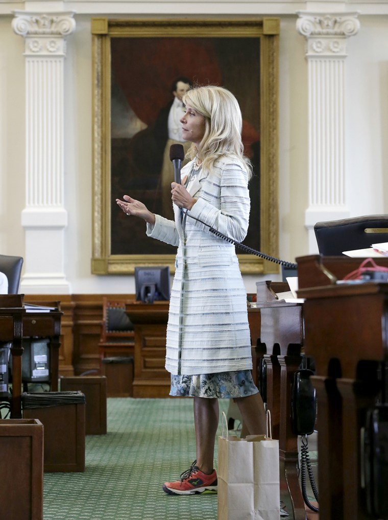 Sen. Wendy Davis, D-Fort Worth, filibusters in an effort to kill an abortion bill, Tuesday, June 25, 2013, in Austin, Texas. The bill would ban aborti...